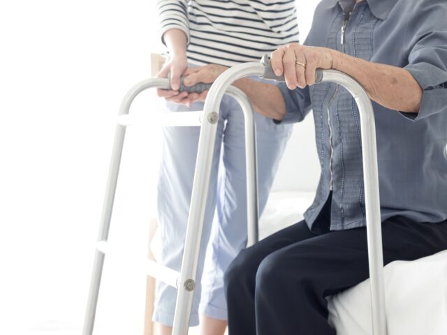 Person with long term disability using a walker