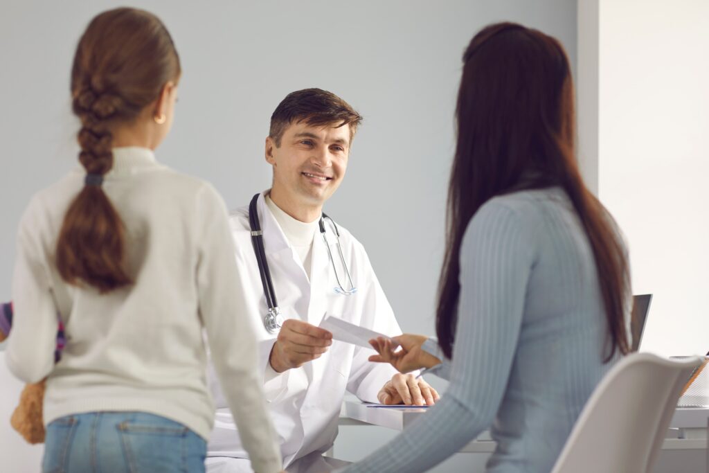 Young woman with a long term disability asking a doctor question