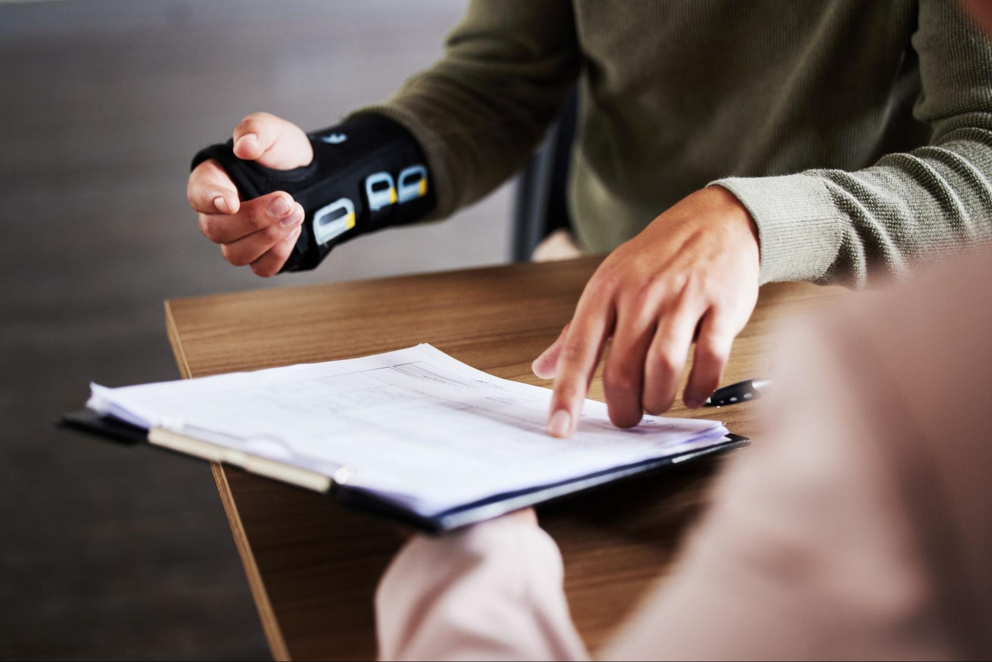 Client pointing at documents