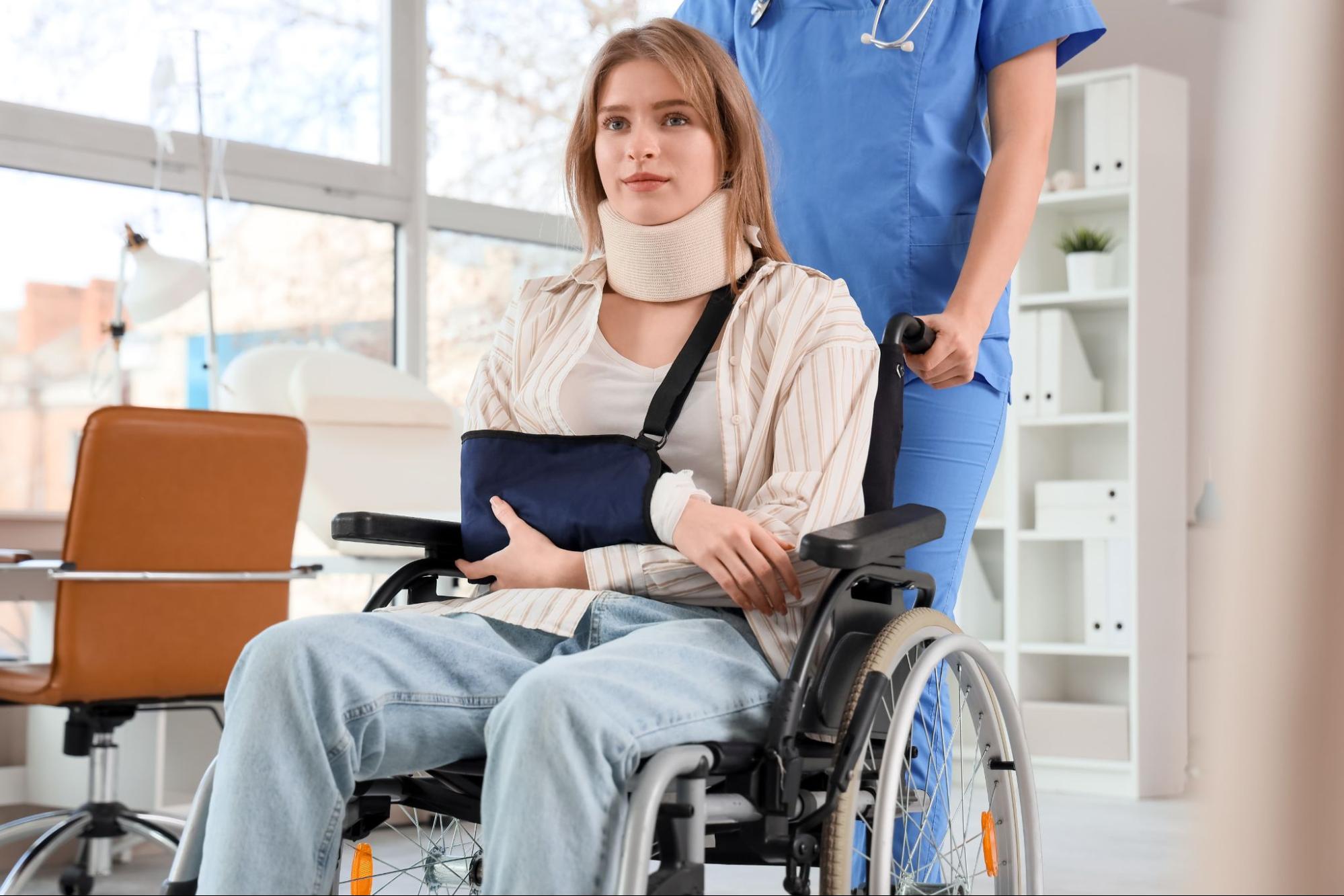woman-in-wheelchair-with-neckbrace-and-arm-in-sling